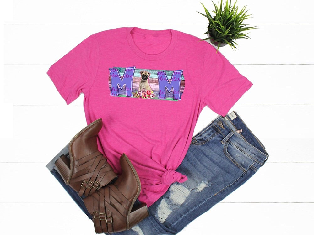 Pug Mom written on a shirt
