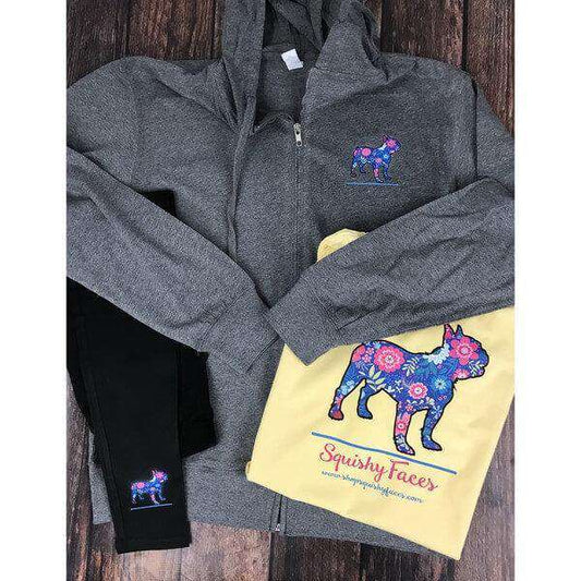 Image of a zip-up hoodie jacket featuring a standing French bulldog silhouette filled with a blue and pink floral pattern.