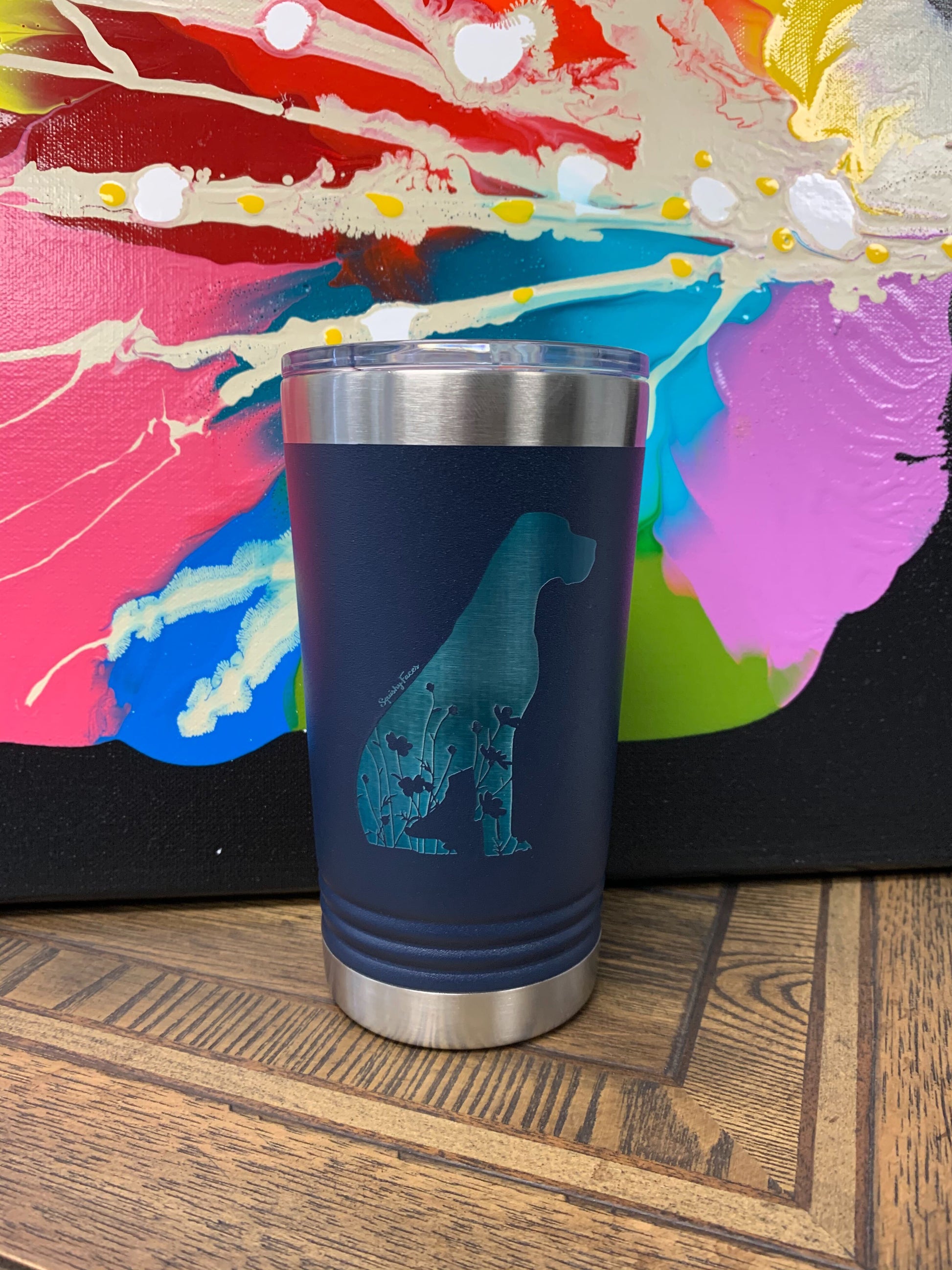 Image of an insulated tumbler in Royal with metal rim, clear plastic lid, featuring a sweet Great Dane silhouette filled with flowers and the words "Squishy Faces" laser etched in the side of the cup.